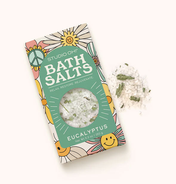 Studio Oh! Eucalyptus Bath Salts pack with sample salts and dried leaves dispensed at right of packaging