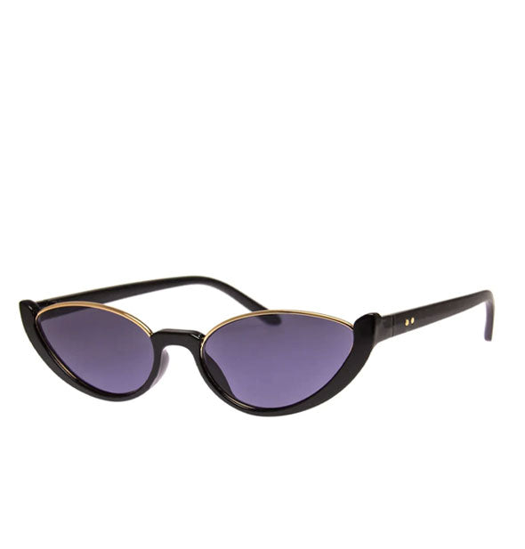 Black sunglasses with black plastic temple arms and bottom rims and a gold metal top rim around blueish-gray lenses