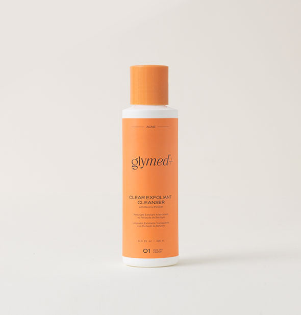 Orange and white 8 ounce bottle of GlyMed+ Clear Exfoliant Cleanser