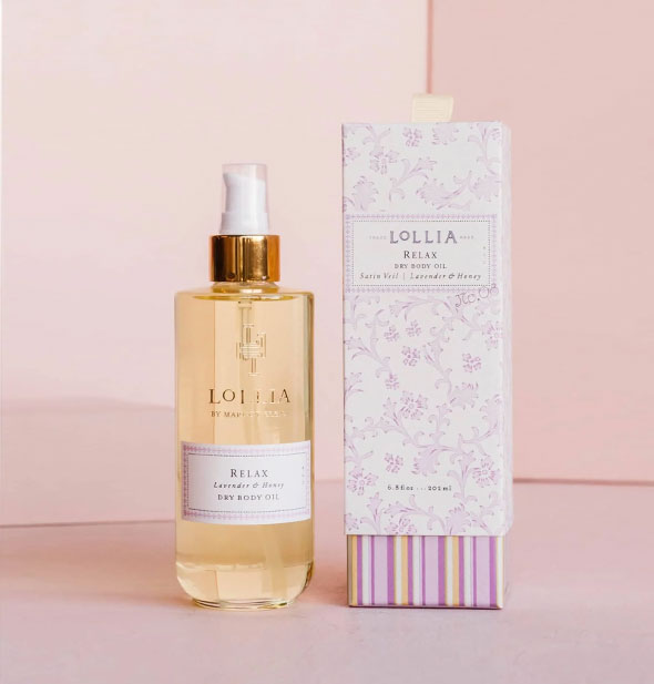 Glass bottle of Lollia Relax Lavender & Honey Dry Body Oil with decorative floral and striped box