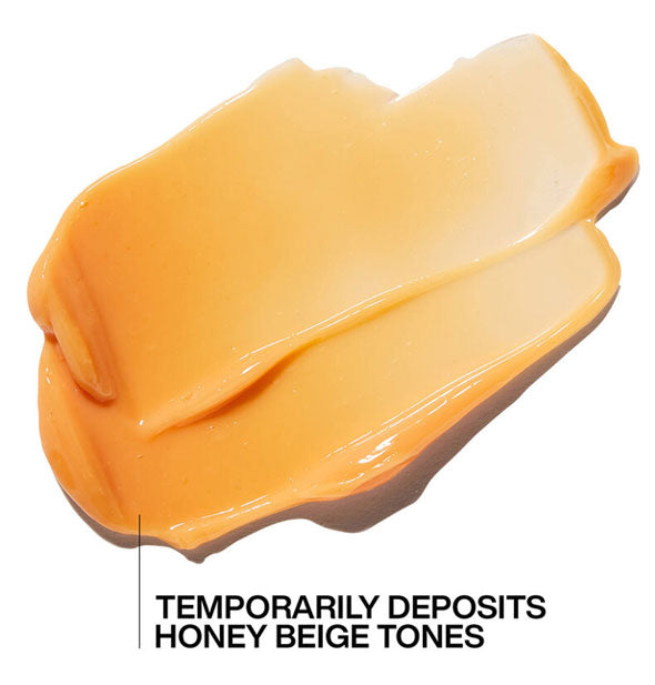 Closeup sample of Redken Honey Beige Blonde Color-Depositing Mask is labeled, "Temporarily deposits honey beige tones"