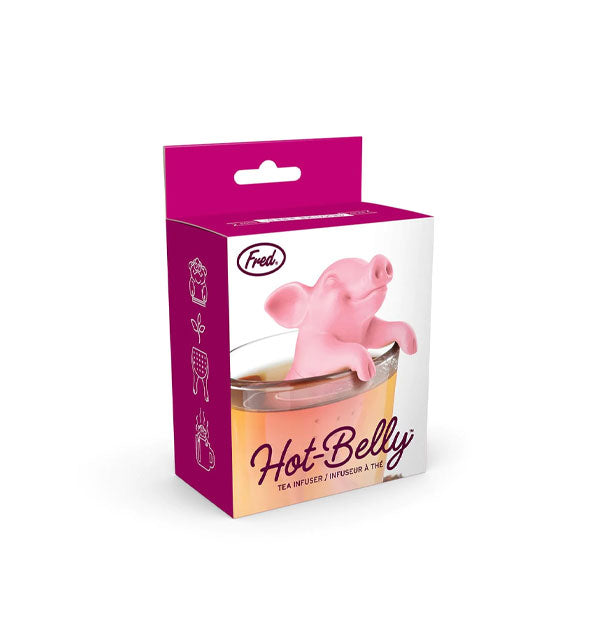Hot-Belly Tea Infuser packaging depicts a pink smiling pig in a cup of tea with hooves hooked over the mug's rim