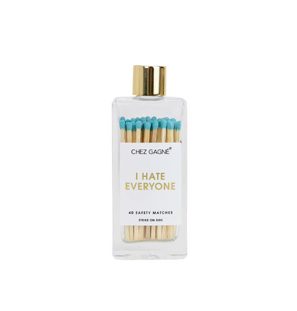 Rectangular glass bottle containing 40 teal-tipped Chez Gagné safety matches and topped with a gold lid says, "I hate everyone" in gold foil