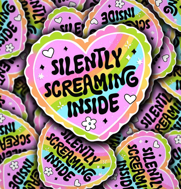 Grouping of pink heart-shaped stickers with rainbow, heart, flower, and star accents say, "Silently screaming inside" in black lettering