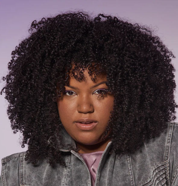 Model demonstrates the result of using Bumble and bumble Curl 3-In-1 Conditioner