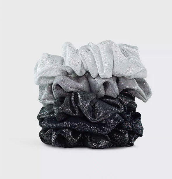 Stack of five hair scrunchies in gray metallic fabrics