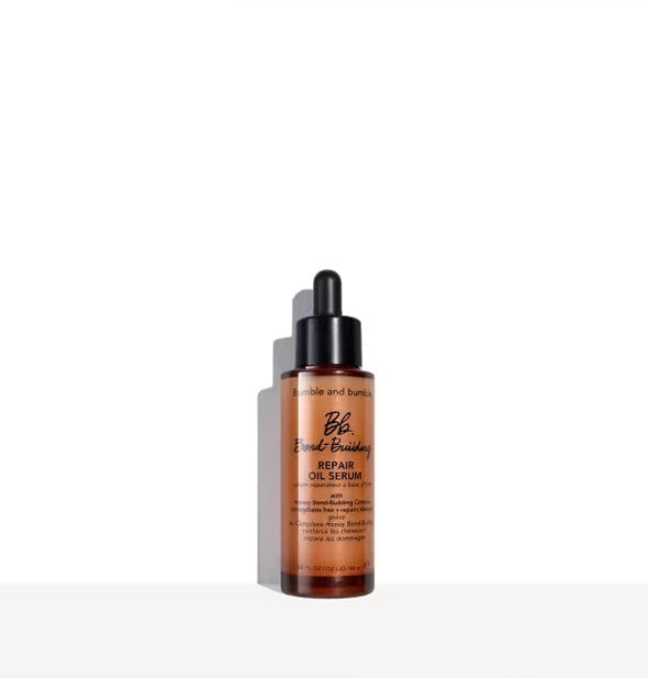 Small bronze-colored bottle of Bumble and bumble Bond-Building Repair Oil Serum with black dropper cap