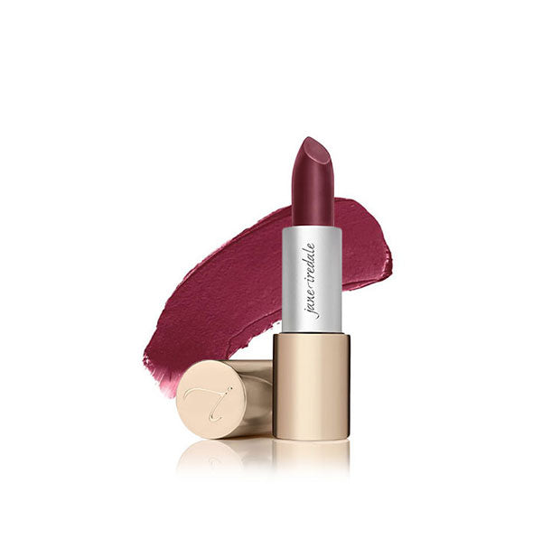 Tube of Jane Iredale lipstick with cap removed and sample swatch behind in the shade Ella