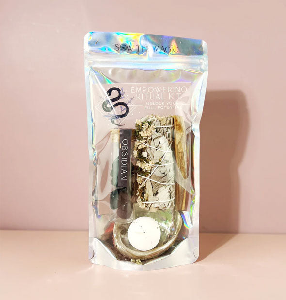 Holographic Empowering Ritual Kit bag with clear window through which contents are visible