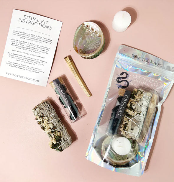 Contents of the Empowering Ritual Kit include sage bundle, obsidian stones vial, palo santo stick, abalone shell, white candle, and instruction sheet