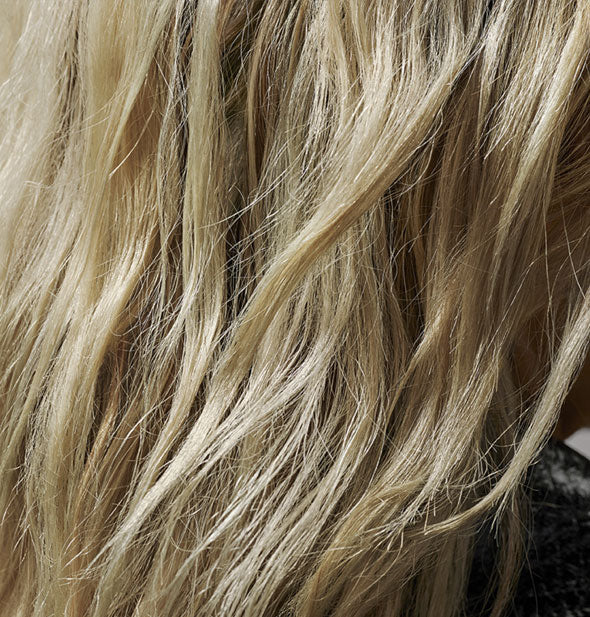 Closeup of hair styled with Oribe Flash Form Finishing Spray Wax