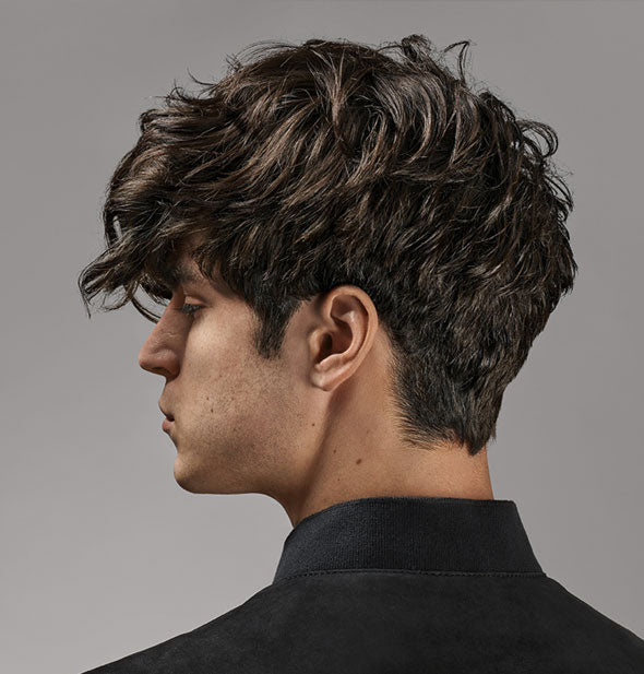 A model's short hair is styled with Oribe Flash Form Finishing Spray Wax