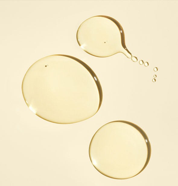 Sample droplets of Oribe Gold Lust Nourishing Hair Oil