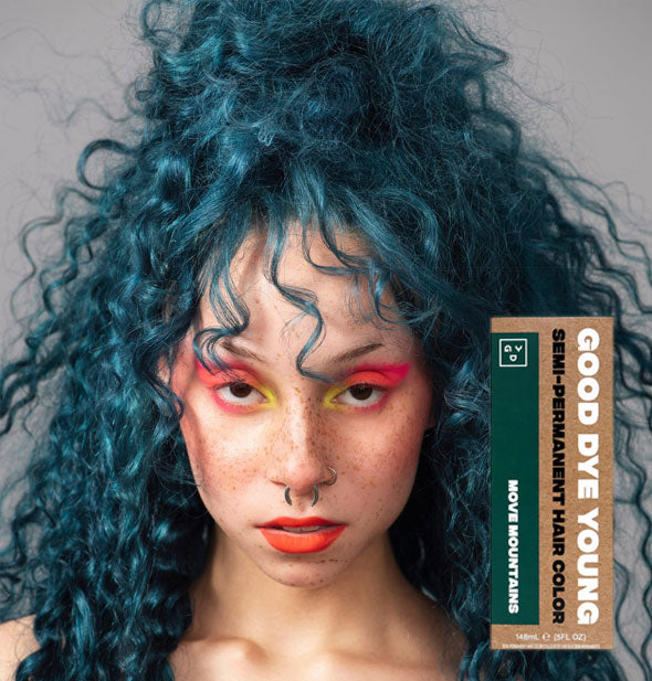 Model with dark teal hair color by Good Dye Young in the shade Move Mountains