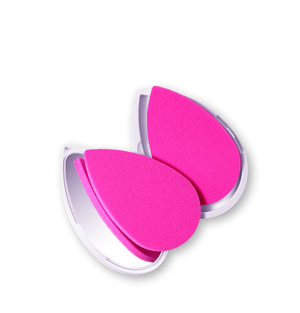 Two pink facial sponges in a compact