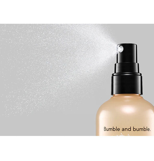A spray application is dispensed from a bottle of Bumble and bumble Prêt-à-Powder Post Workout Dry Shampoo Mist