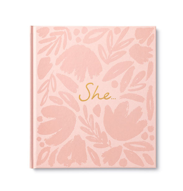 Pink cover of "She..." features metallic gold foil script lettering and all-over darker pink brushstroke flower illustrations