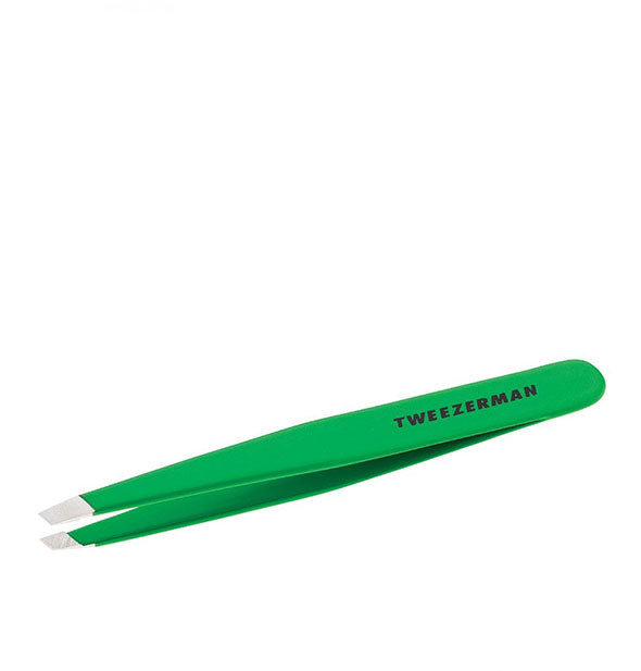 Green Tweezerman tweezer with slanted stainless steel tips