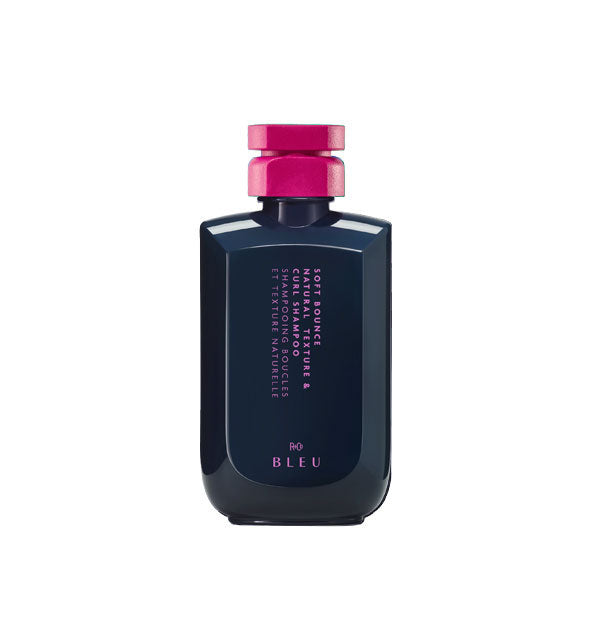 Dark bottle of R+Co Bleu Soft Bounce Texture & Curl Shampoo with pink cap and lettering