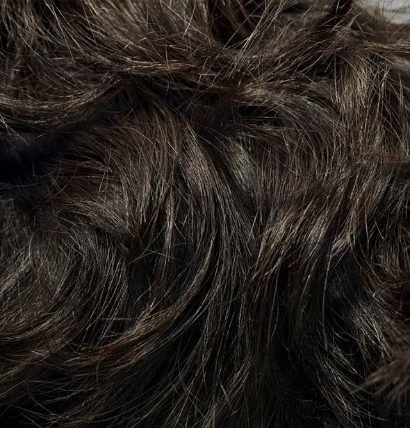 Closeup of hair that is styled with Oribe Thick Dry Finishing Spray