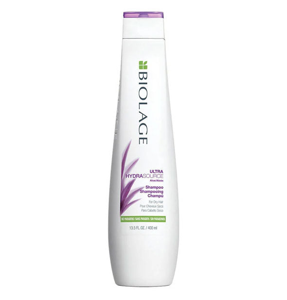 A white 13.5-ounce bottle of Biolage Ultra HydrasSource Shampoo with purple and green accents.
