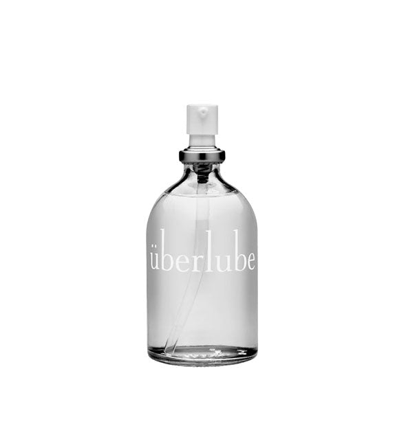 Clear bottle of Überlube lubricant with pump nozzle