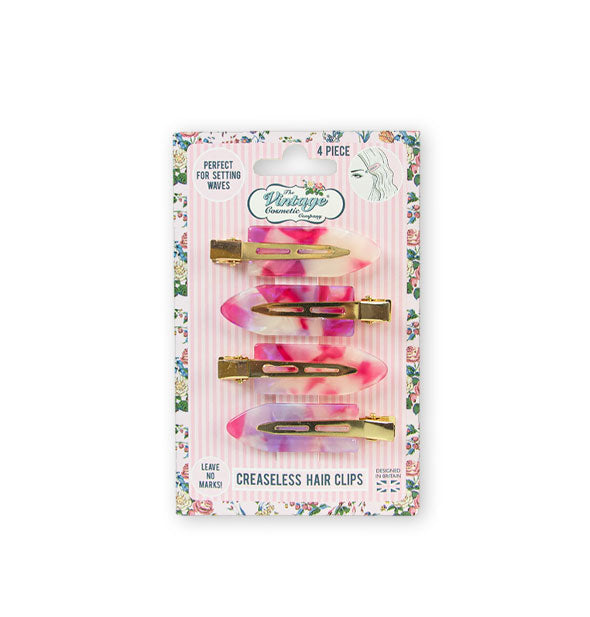 Four pink marbleized hair clips on a pink and white striped Vintage Cosmetic Company product card with floral border
