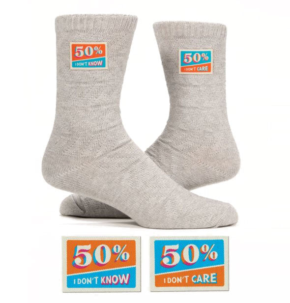 Gray socks with sewn-on blue and orange labels that say, "50% I don't know" and "50% I don't care"