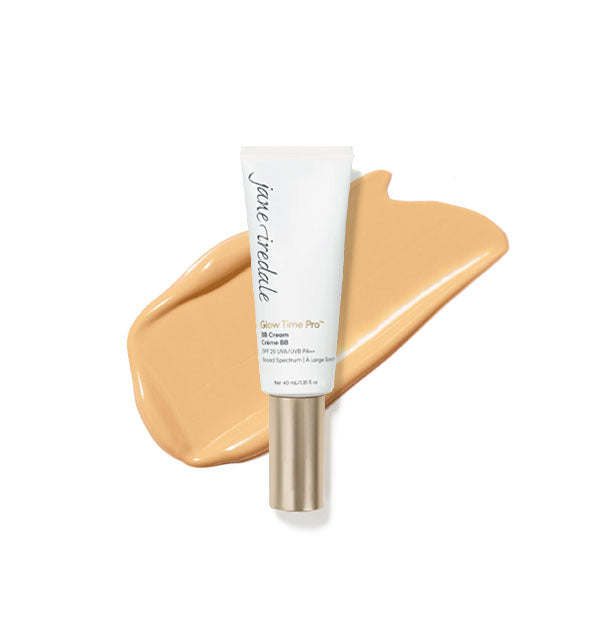 White tube of Jane Iredale Glow Time Pro BB Cream with gold cap is placed in front of an enlarged product application in shade GT6