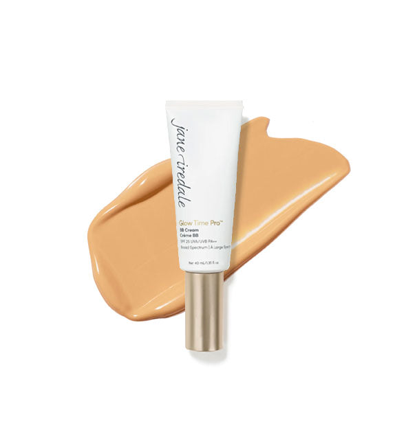 White tube of Jane Iredale Glow Time Pro BB Cream with gold cap is placed in front of an enlarged product application in shade GT7