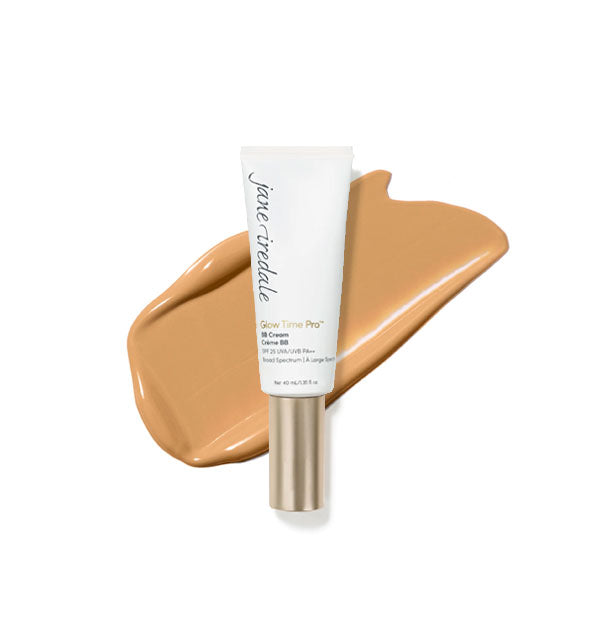 White tube of Jane Iredale Glow Time Pro BB Cream with gold cap is placed in front of an enlarged product application in shade GT8