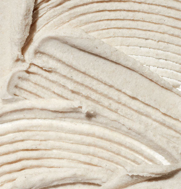 Closeup of body scrub with lines raked through