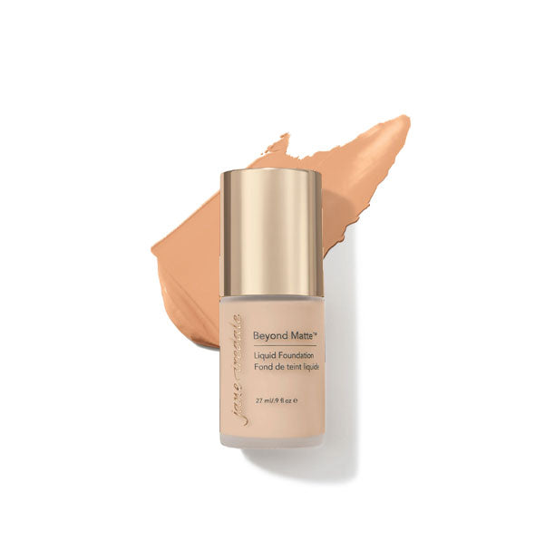 27 ml bottle of Jane Iredale Beyond Matte Liquid Foundation with sample application behind it in the shade M4