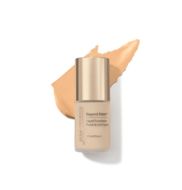 27 ml bottle of Jane Iredale Beyond Matte Liquid Foundation with sample application behind it in the shade M5
