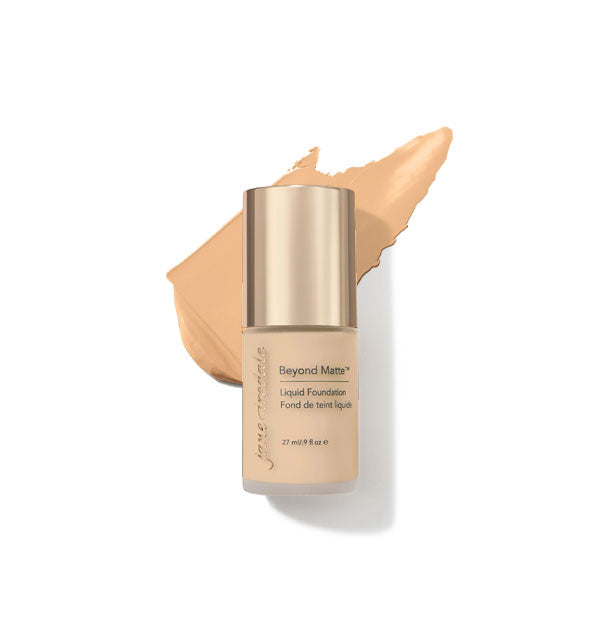 27 ml bottle of Jane Iredale Beyond Matte Liquid Foundation with sample application behind it in the shade M6