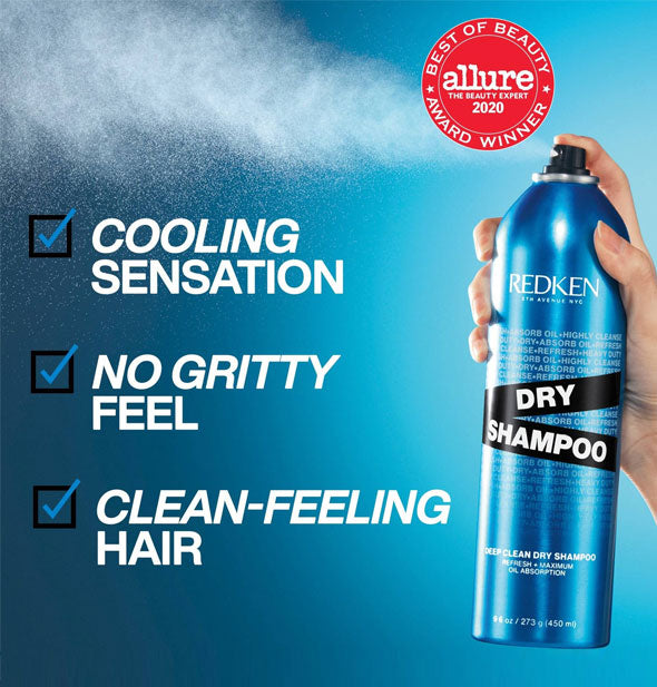 Image of a model's hand dispensing a fine mist of Redken Dry Shampoo from a can against a blue background is labeled, "Cooling sensation, no gritty feel, clean-feeling hair"