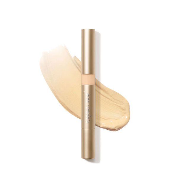 Gold tube of Jane Iredale Active Light Concealer with sample product application underneath in the shade No. 1 - Light Yellow