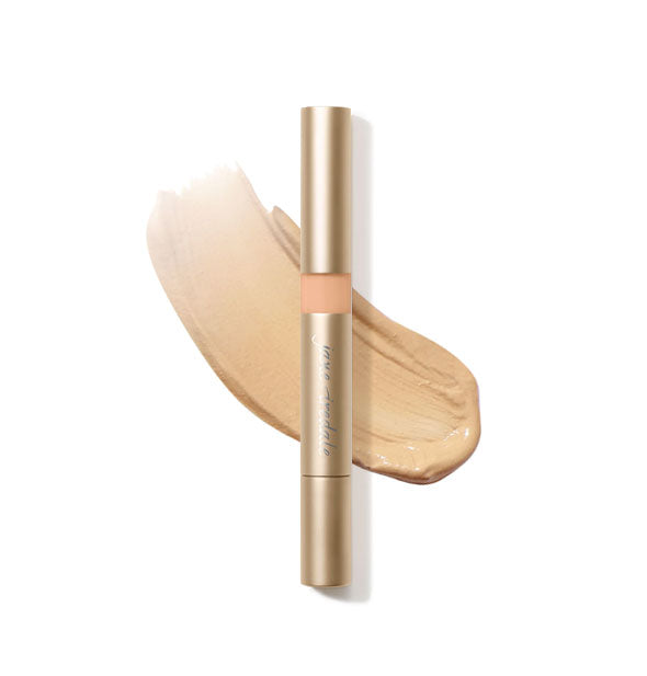 Gold tube of Jane Iredale Active Light Concealer with sample product application underneath in the shade No. 2 - Medium Yellow
