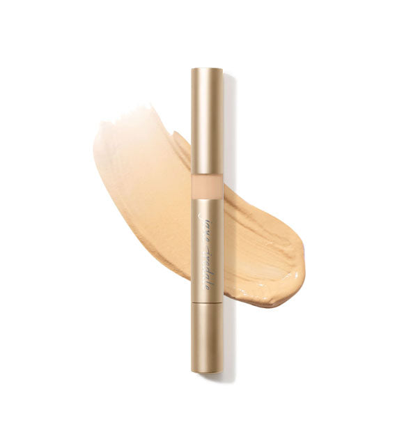 Gold tube of Jane Iredale Active Light Concealer with sample product application underneath in the shade No. 5 - Medium Yellow Gold