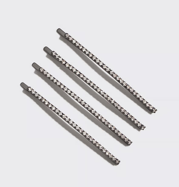 Four hematite hair pins accented with lines of rhinestones