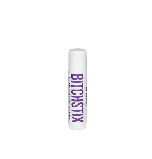 White tube of Bitchstix lip balm with purple lettering