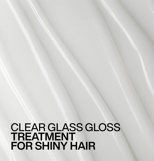 Closeup of smooth, white Redken Acidic Color Gloss Treatment with ridges raked through is captioned, "Clear Glass Gloss Treatment for shiny hair"