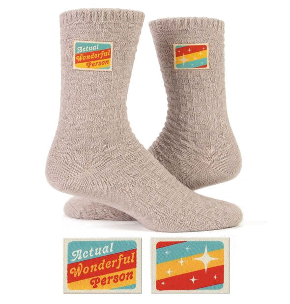 Woven beige socks with colorful sewn-in ankle labels, one of which says, "Actual Wonderful Person"