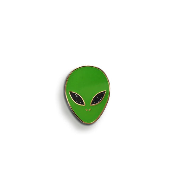 Green enamel alien face pin with black eyes and gold edging