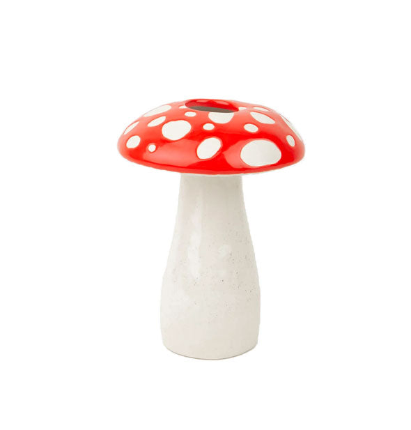 Ceramic vase is shaped like a mushroom with white base and a wider red top with white polka dots