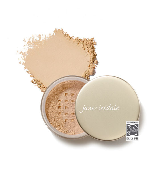 Opened compact of Jane Iredale Amazing Base Loose Mineral Powder and sample product swatch in shade Amber with the Skin Cancer Foundation seal at lower right