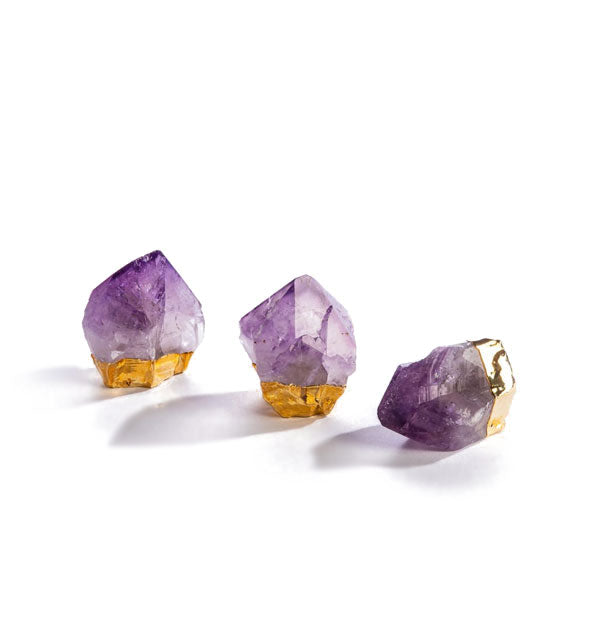 Three purple amethyst crystal points with gold plated bases