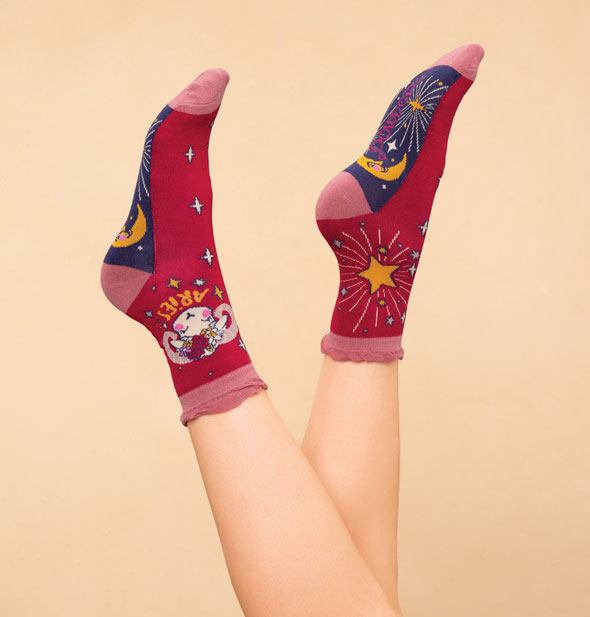 Model's upright feet wear a pair of Aries socks