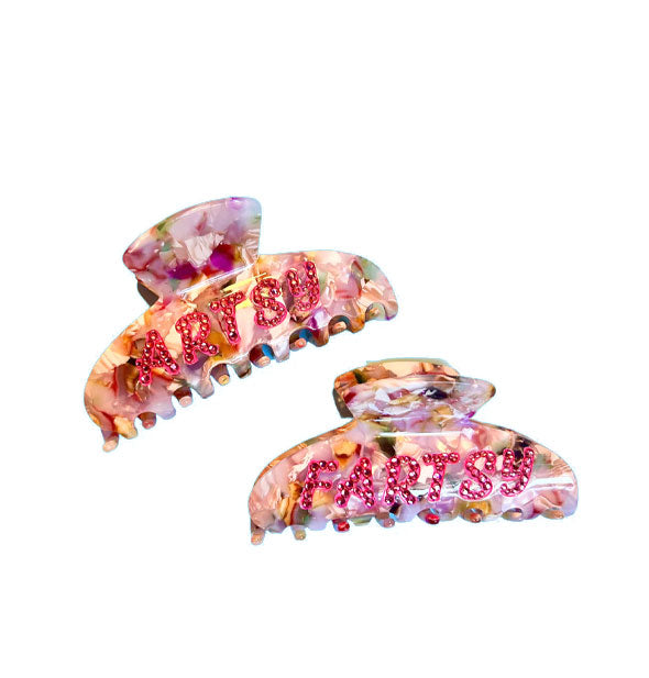 Colorful quartz-effect hair clips say, "Artsy" and "Fartsy" in pink with rhinestone accents