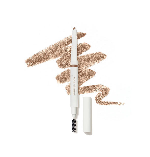 White Jane Iredale brow pencil with cap removed to show angled tip on top and spoolie brush on bottom is placed in front of a drawn squiggle of product in shade Ash Blonde